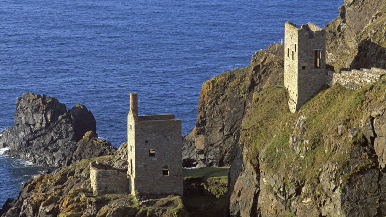 Botallack Mine on the Cornish coast near St Just. A view from the cliffs above the Crowns engine houses mines, perched precariously on the rocks.